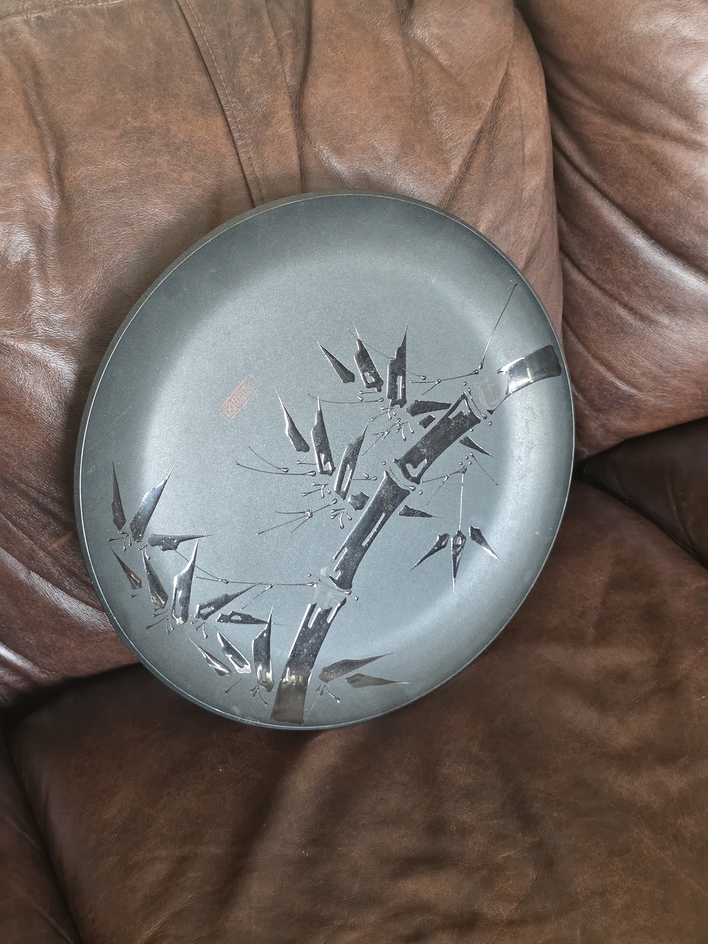 Asian Decorative Plate. Black Plastic Plate with Bamboo Motif. 15 Inch Diameter.
